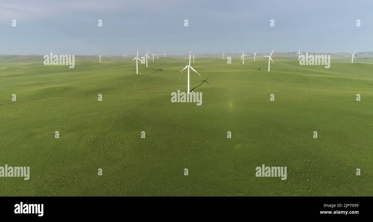 ULANQAB, CHINA - JULY 28, 2022 - Aerial view of a wind farm on the grassland in Ulanqab, Inner Mongolia, China, July 28, 2022. Stock Photo