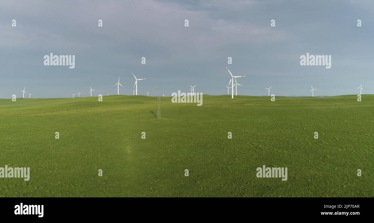 ULANQAB, CHINA - JULY 28, 2022 - A view of a wind farm on the grassland in Ulanqab, Inner Mongolia, China, July 28, 2022. Stock Photo