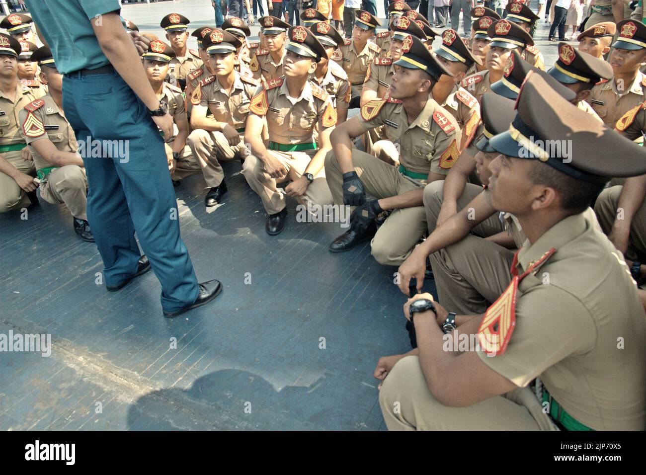 Indonesian navy cadets and officers attending a briefing, as KRI Dewaruci (Dewa Ruci), an Indonesian tall ship, is opened for public visitors at Kolinlamil harbour (Navy harbour) in Tanjung Priok, North Jakarta, Jakarta, Indonesia. Stock Photo