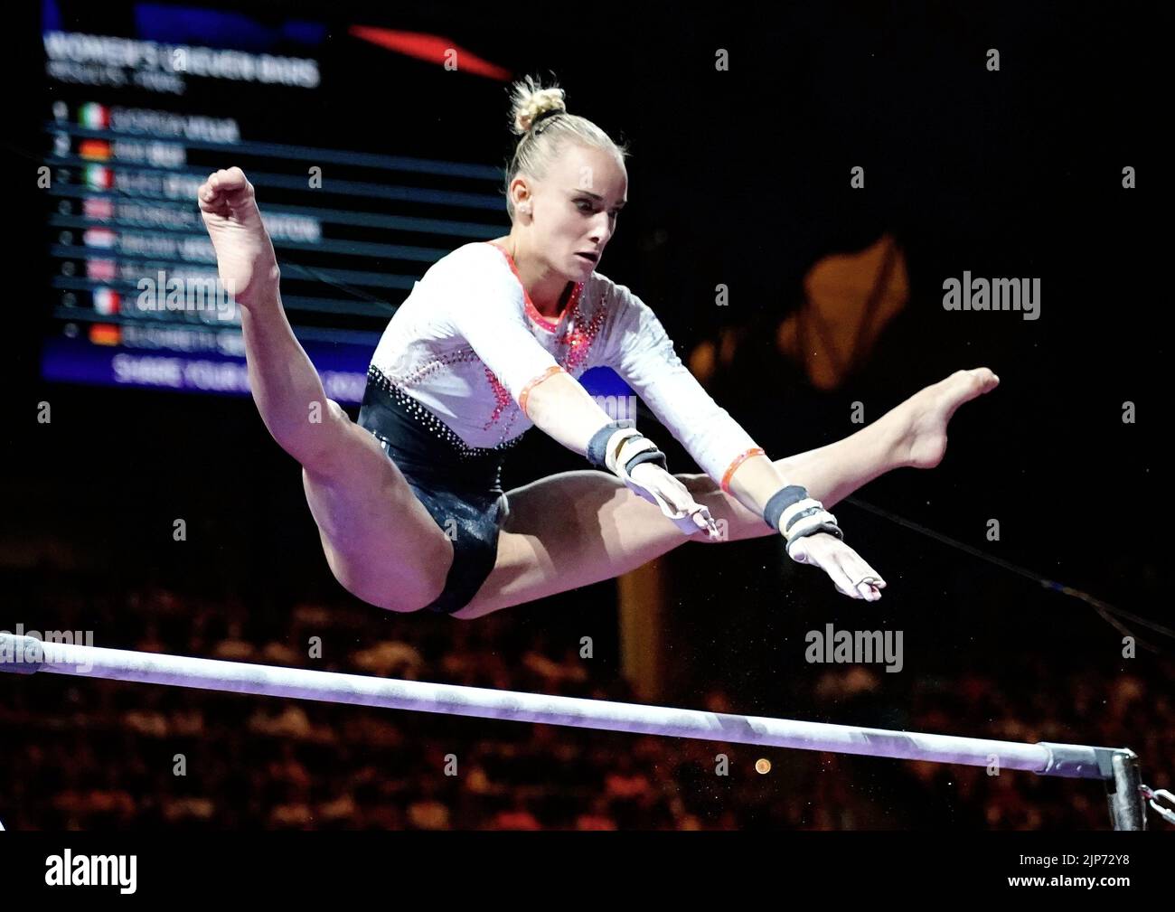 Alice D AMATO ITA) is performing her routine on the Womens Uneven Bars