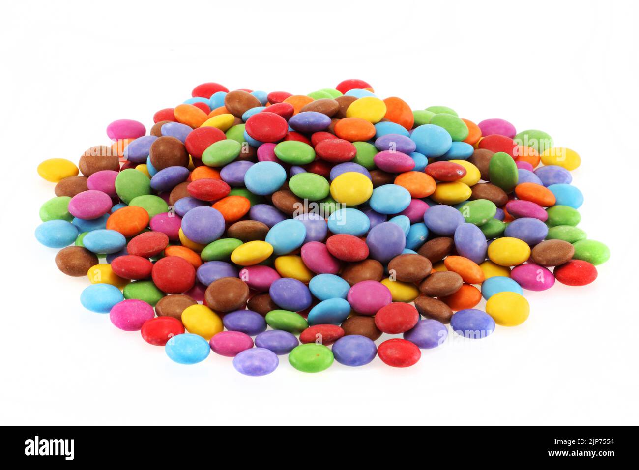 Heap of multi coloured halloween candy sweets on white Stock Photo