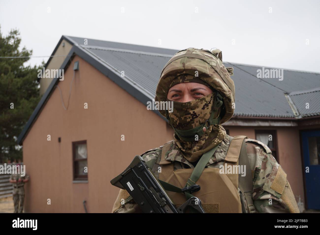 Uk. 15th Aug, 2022. Snejana (34) from Ukraine, a trainer for the Ukrainian military who is also taking part in the training and exchanging ideas with British trainers, stands at a military training ground in southeast England. There, Ukrainians are trained to fight in their home country in a training that lasts several weeks. Credit: Larissa Schwedes/dpa/Alamy Live News Stock Photo