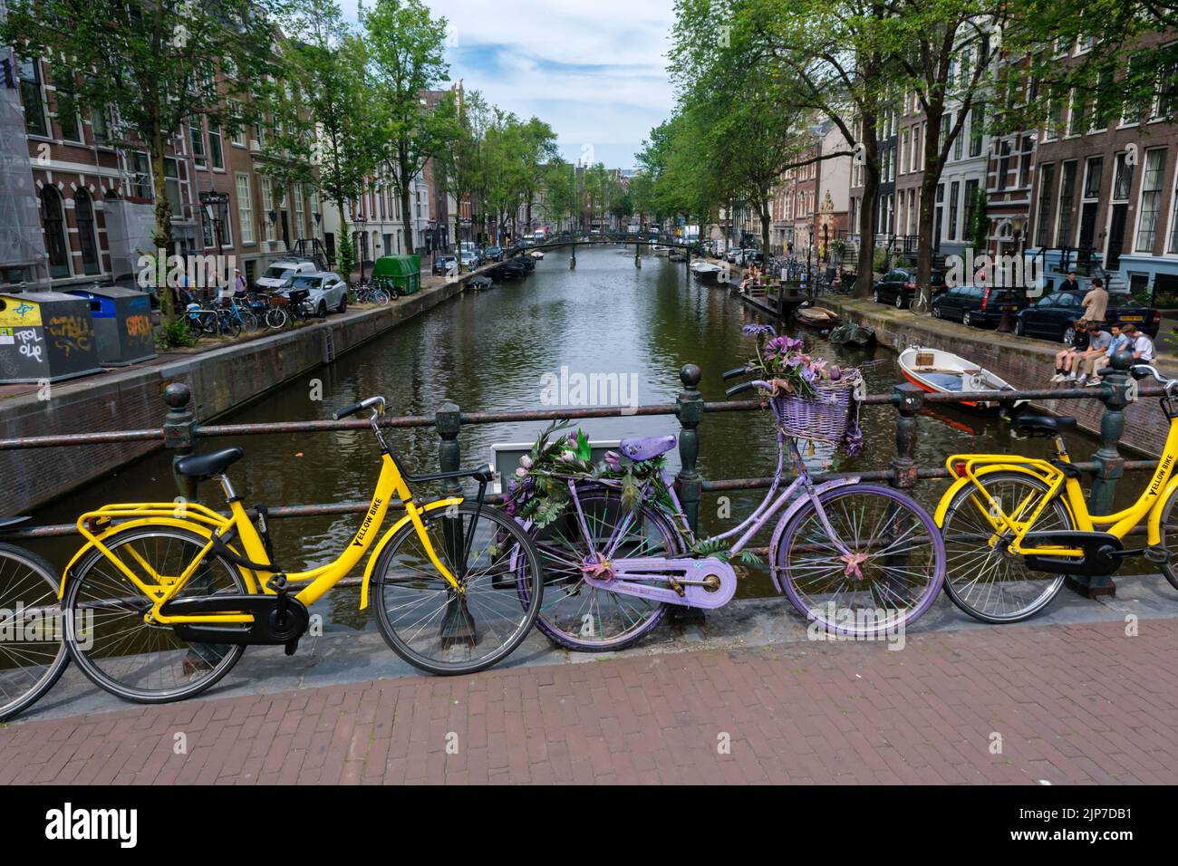 Amsterdam, The Netherlands - 21 June 2022: Amsterdam cityscape with bikes on a bridge Stock Photo