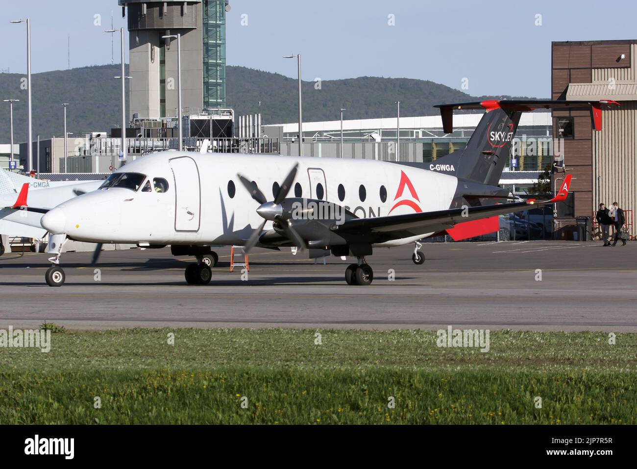A Skyjet Aviation (Air Liaison) Beechcraft 1900D taxiing at Quebec airport. Air Liaison is a regional airline based in Quebec City, Quebec with its base at Québec City Jean Lesage International Airport. It operates scheduled flights to 16 domestic destinations from Monday to Friday.The Beechcraft 1900 is a 19-passenger, pressurized twin-engine turboprop fixed-wing aircraft that was manufactured by Beechcraft. It was designed and is primarily used, as a regional airliner. It is also used as a freight aircraft and corporate transport. Stock Photo