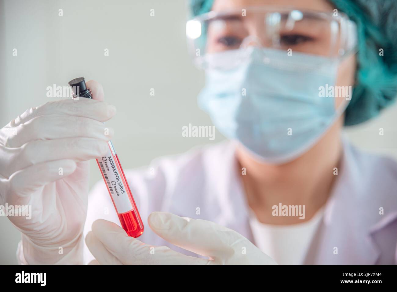 A doctor or scientist is holding an antigen blood testing tube for ...