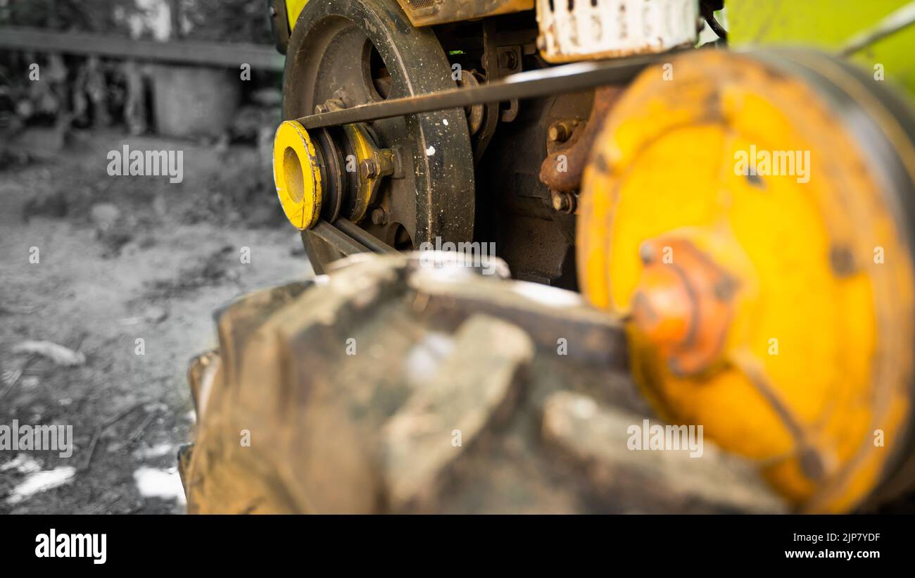Garden walkbehind tractor closeup on a black and white background