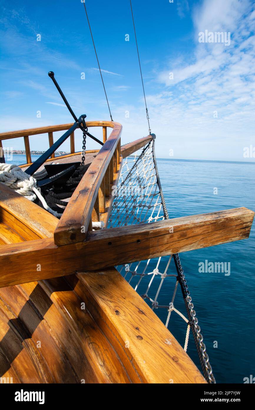 bow of with fishing net and anchor on a tourist pirate boat Stock Photo
