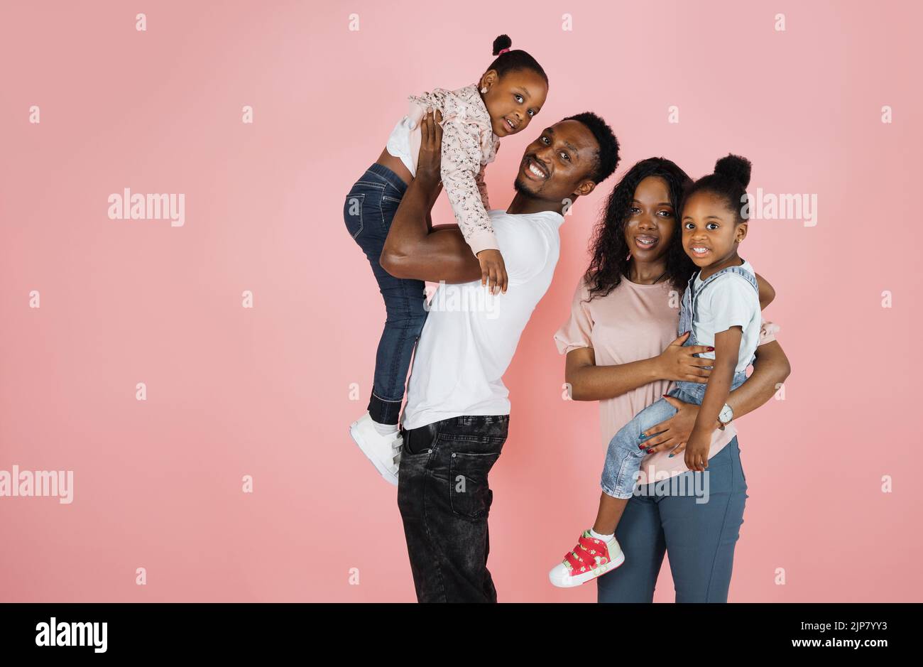 Time with family. Overjoyed african american family laughing and posing