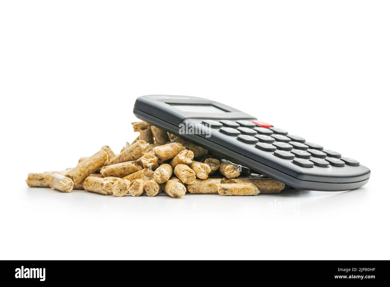 Wooden pellets and calculator isolated on a white background. The concept of paying for heating. Stock Photo