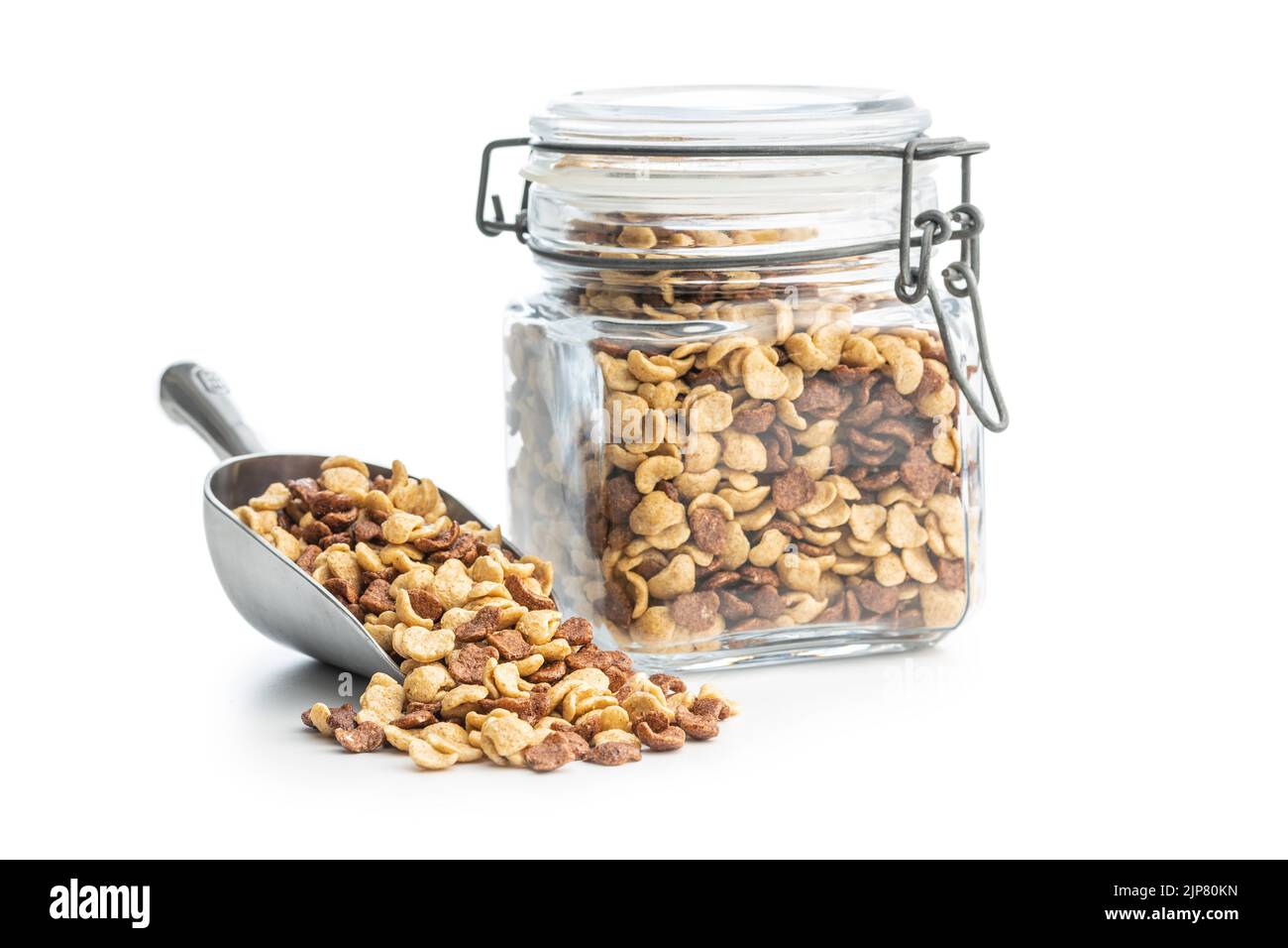 Breakfast cereal flakes in metal scoop isolated on a white background. Stock Photo