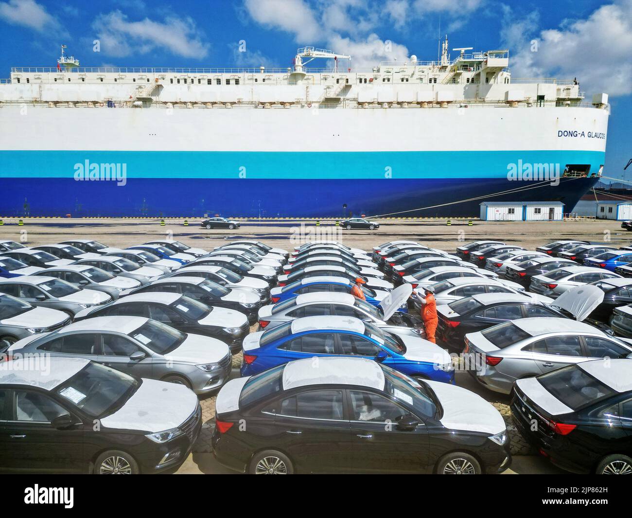 YANTAI, CHINA - AUGUST 16, 2022 - Staff members carry out spot checks on exported commodity vehicles at Yantai Port, Shandong Province, China, Aug 16, Stock Photo
