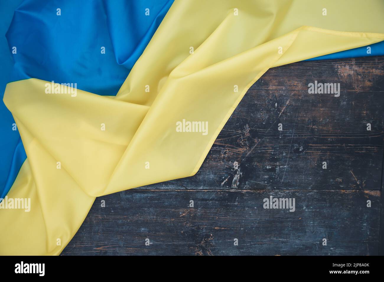 Flag of Ukraine on wooden background. Stock Photo