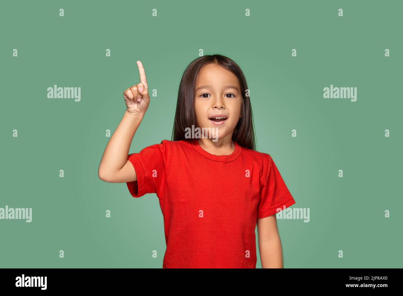 Little girl in red tshirt with finger up Stock Photo Alamy