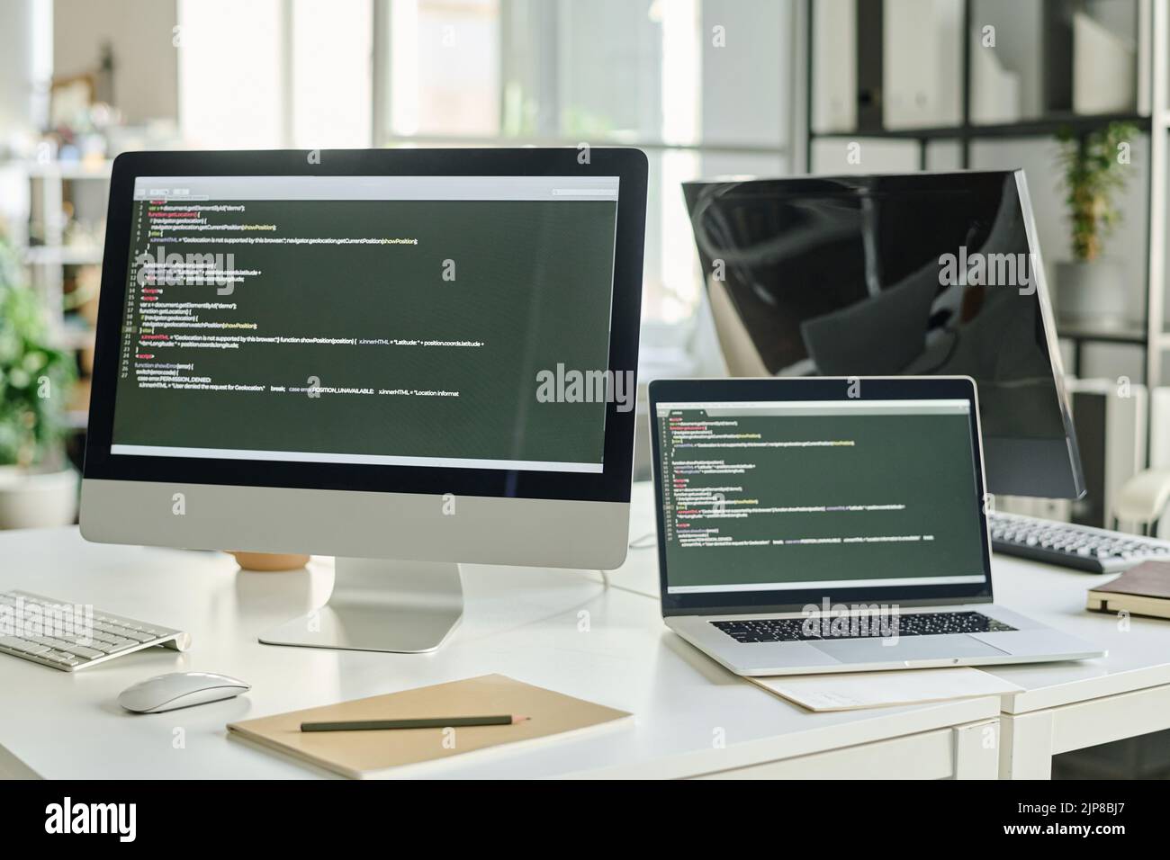 Horizontal image of computer with new software on screen with codes ...