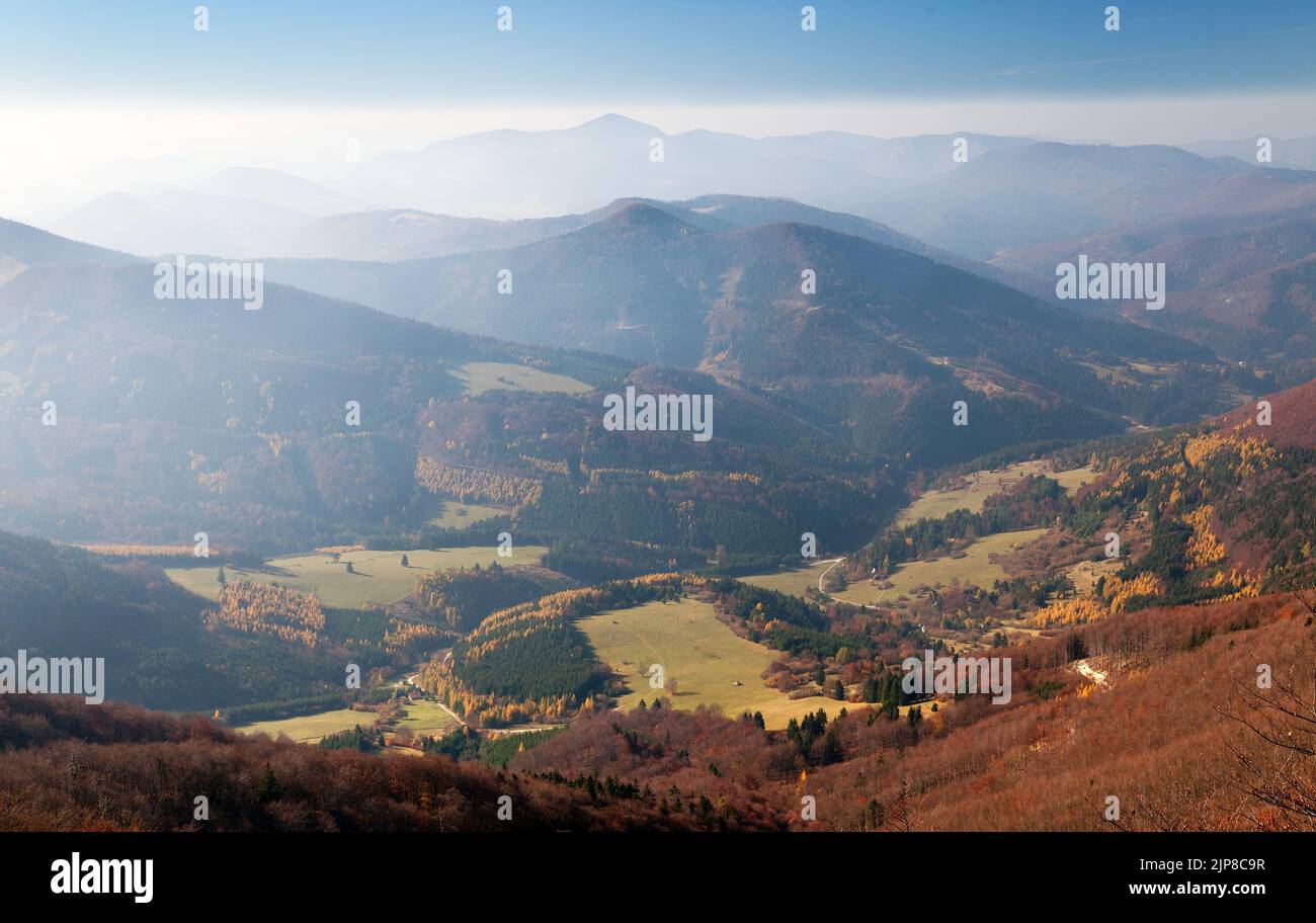 Autumnal view from mount Klak to Strazovske vrchy with blue horizons, Carpathian mountains, Slovakia Stock Photo