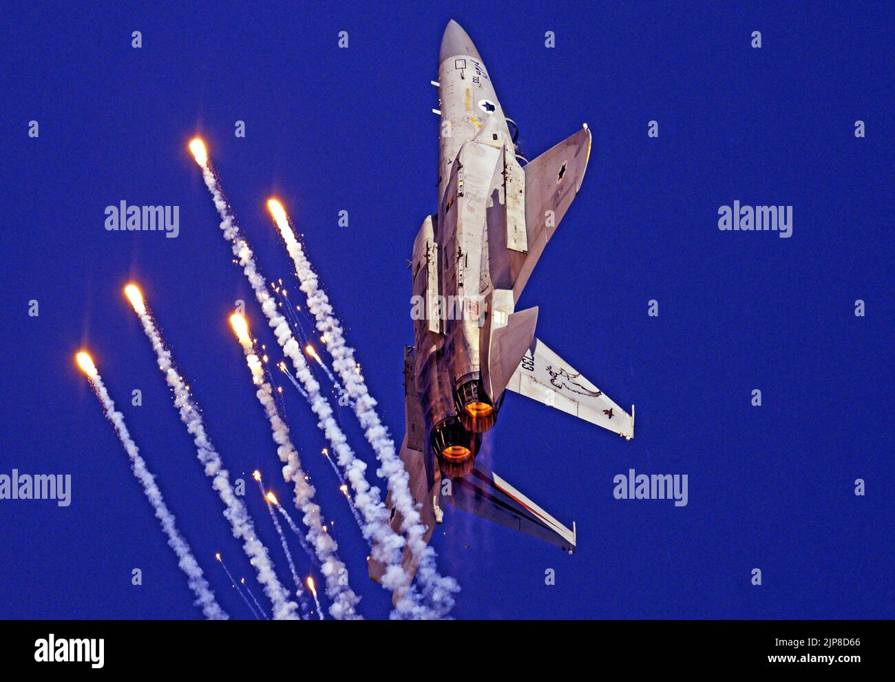 Israeli Air force (IAF) F-15 (Baz) Fighter jet in flight with anti aircraft defensive flares Stock Photo