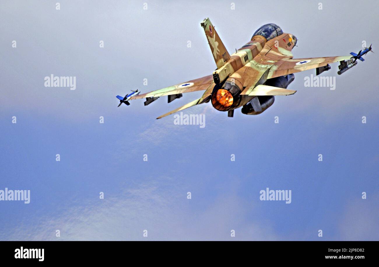Israeli Air Force (IAF) General Dynamics F-16 in flight with a blue sky background. Stock Photo