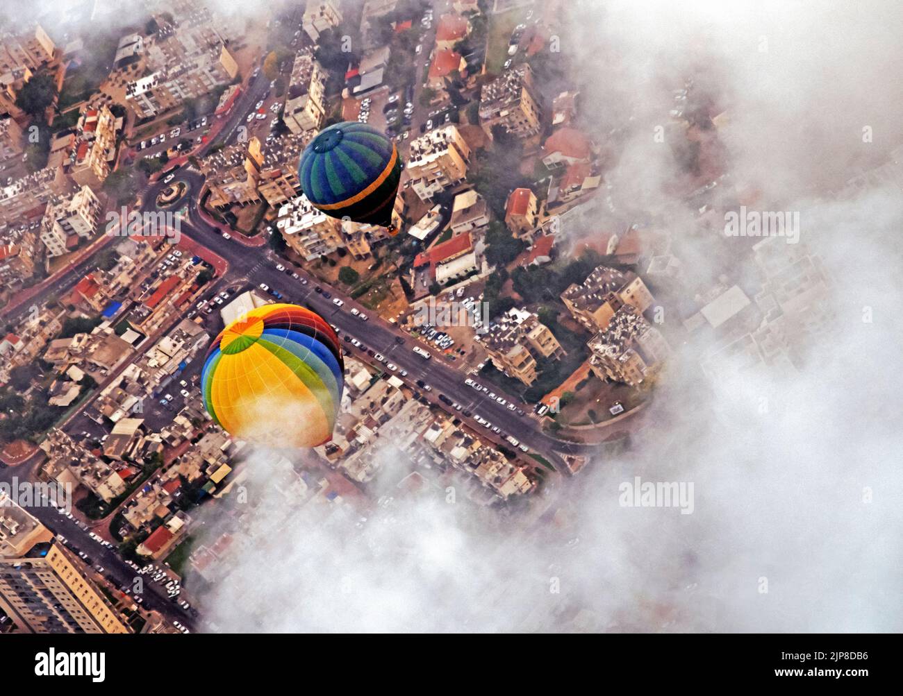 Hot Air Balloon floats in the air as seen from above Stock Photo