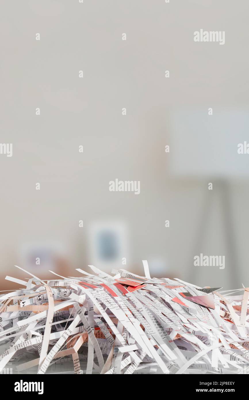 Cut up credit cards on Shredded Bills and Bank Statements Stock Photo