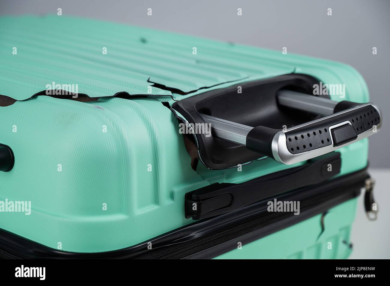 A closeup of a broken plastic suitcase Stock Photo Alamy