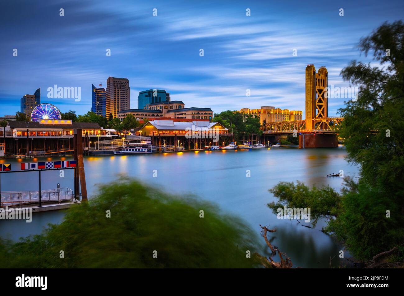 Tower Bridge and Sacramento River in Sacramento, California, captured at night Stock Photo