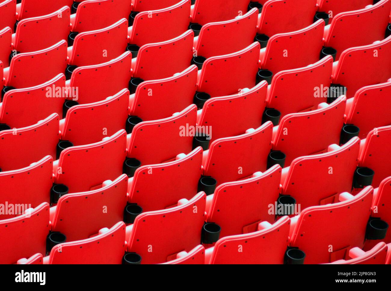 Rows of Red Seats in a Stadium in London UK Stock Photo