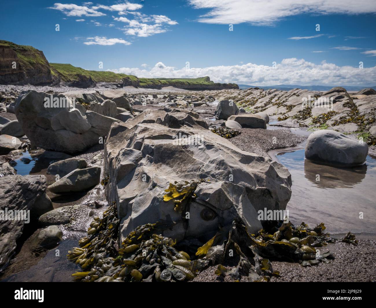 Rocks and boulders on the shoreline Stock Photo