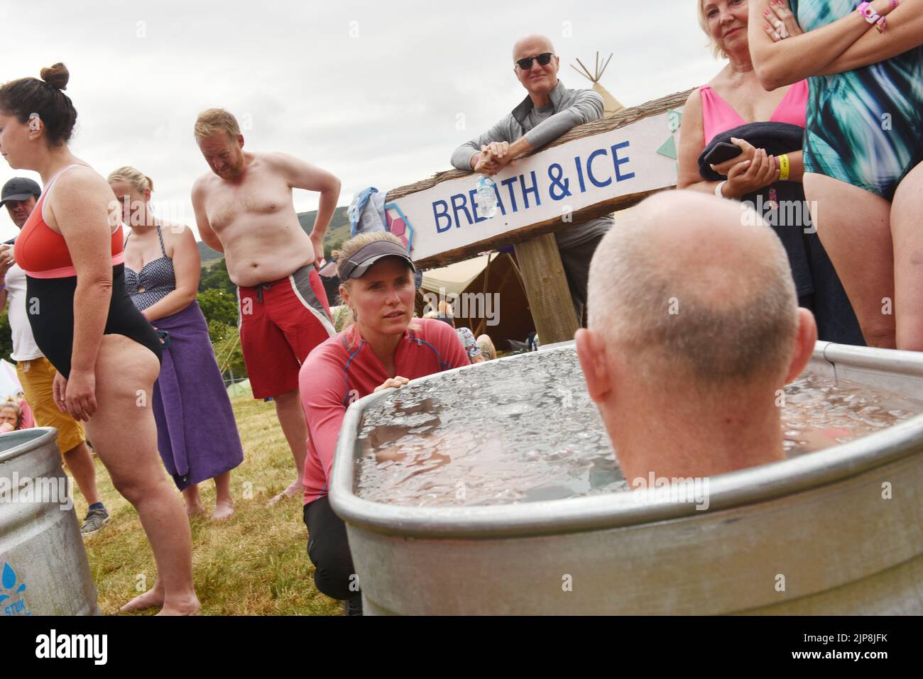 Aodhnait Lombard well being, performance coach and official Wim Hof Method Instructor takes an ice bath session @ family festival Camp Bestival @ Lulworth Castle and Estate, Dorset July 28 - 31 2022 Stock Photo