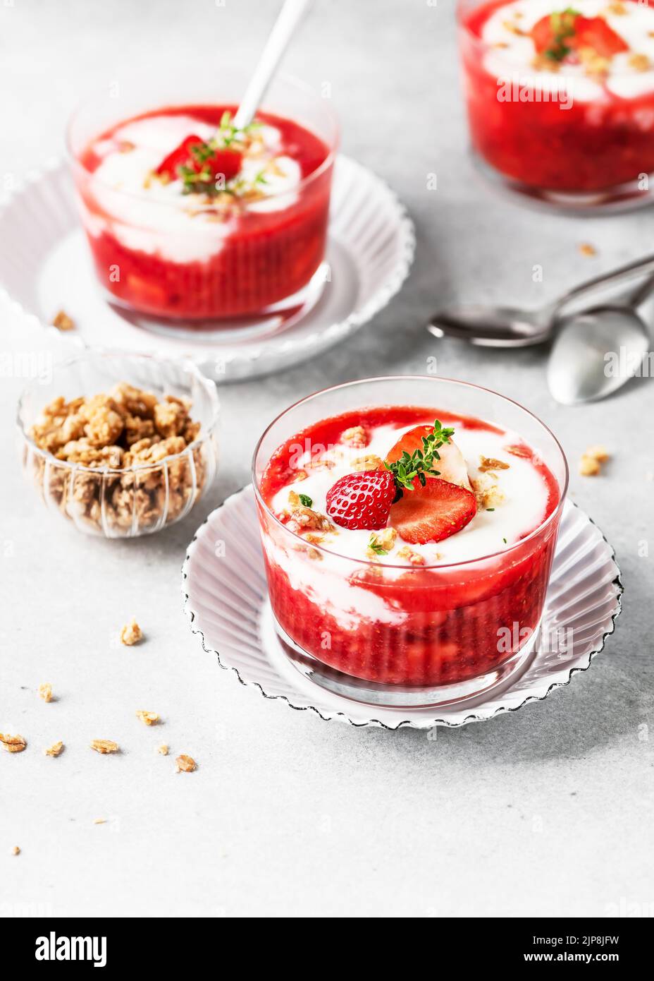 Healthy summer cream cheese dessert with strawberry puree fresh berries