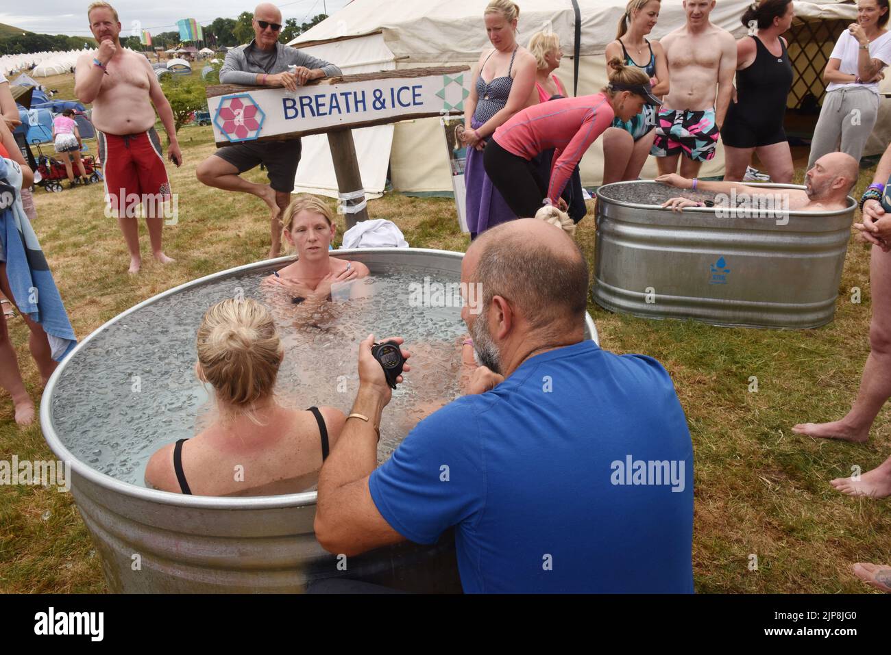 Well being, performance coach and official Will Hof Method Instructor Will van Zyl takes an ice bath session @ family festival Camp Bestival @ Lulworth Castle and Estate, Dorset July 28 - 31 2022 Stock Photo