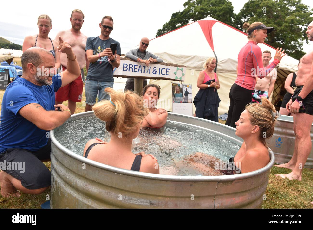 Well being, performance coach and official Wim Hof Method Instructor Will van Zyl takes an ice bath session @ family festival Camp Bestival @ Lulworth Castle and Estate, Dorset July 28 - 31 2022 Stock Photo