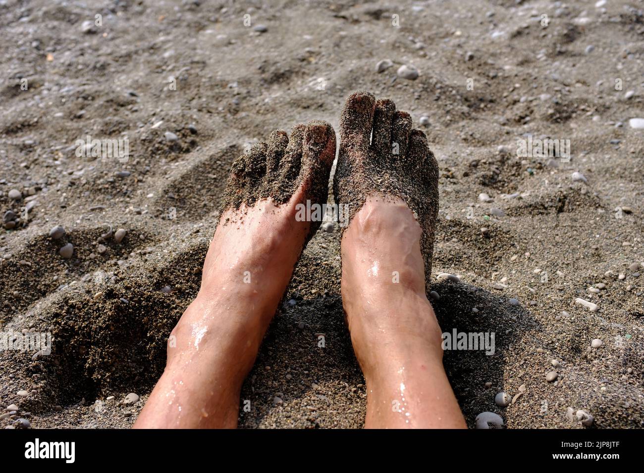 Feet with sand on them Stock Photo