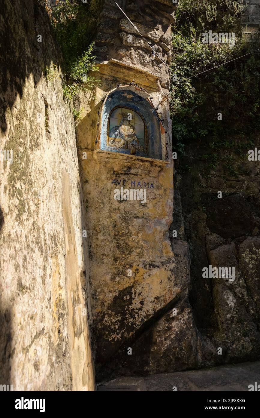 The Madonnelle shrine of Ave Maria in Sorrento on the path between Marina Grande catches the afternoon sun in the narrow streets of Sorrento. Stock Photo