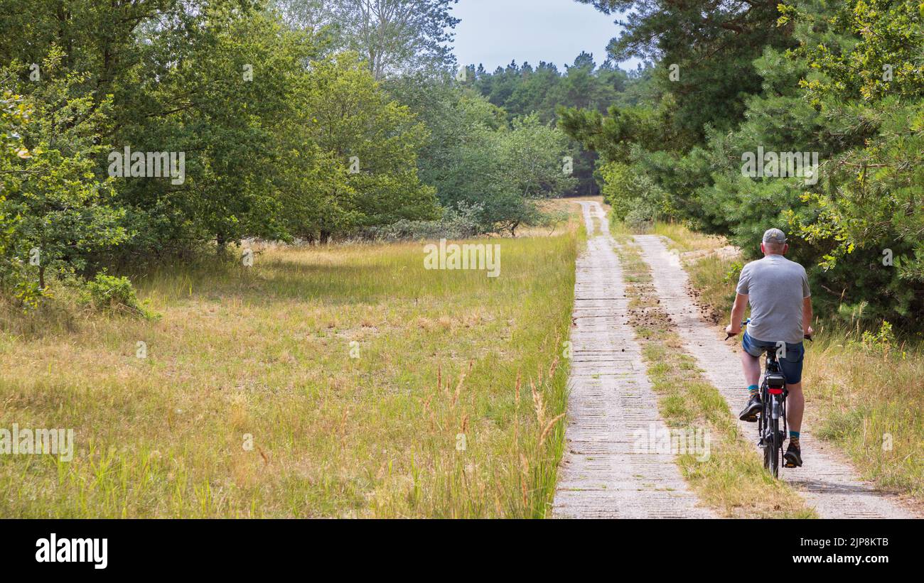 Cycle Germany Tourist cycling along the green belt near Domitz former inner-German ...