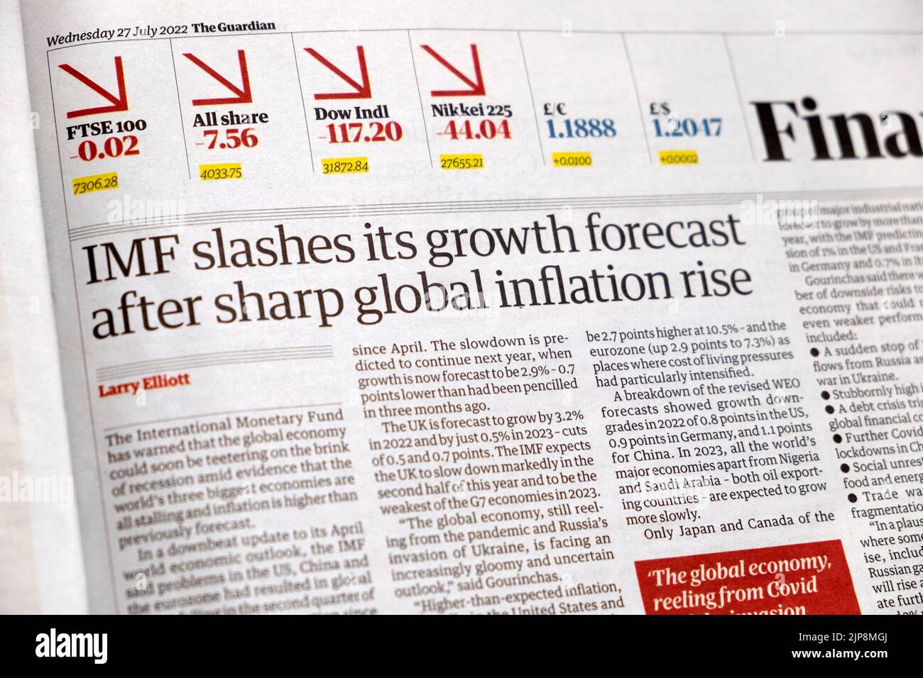 'IMF slashes its growth forecast after sharp global inflation rise' Guardian newspaper headline financial article 27 July London England UK Stock Photo