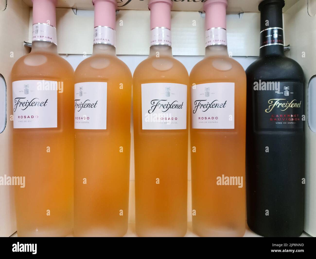 A closeup shot of five bottles of Freixenet brand sparkling wine for sale Stock Photo