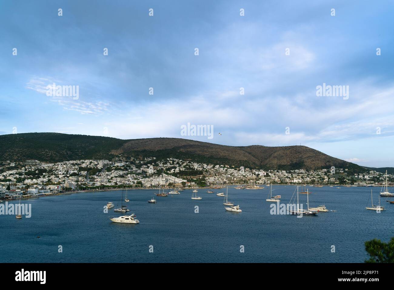 Bodrum view from afar, with ships at sea. Famous holiday village at Turkey, Mugla. Stock Photo