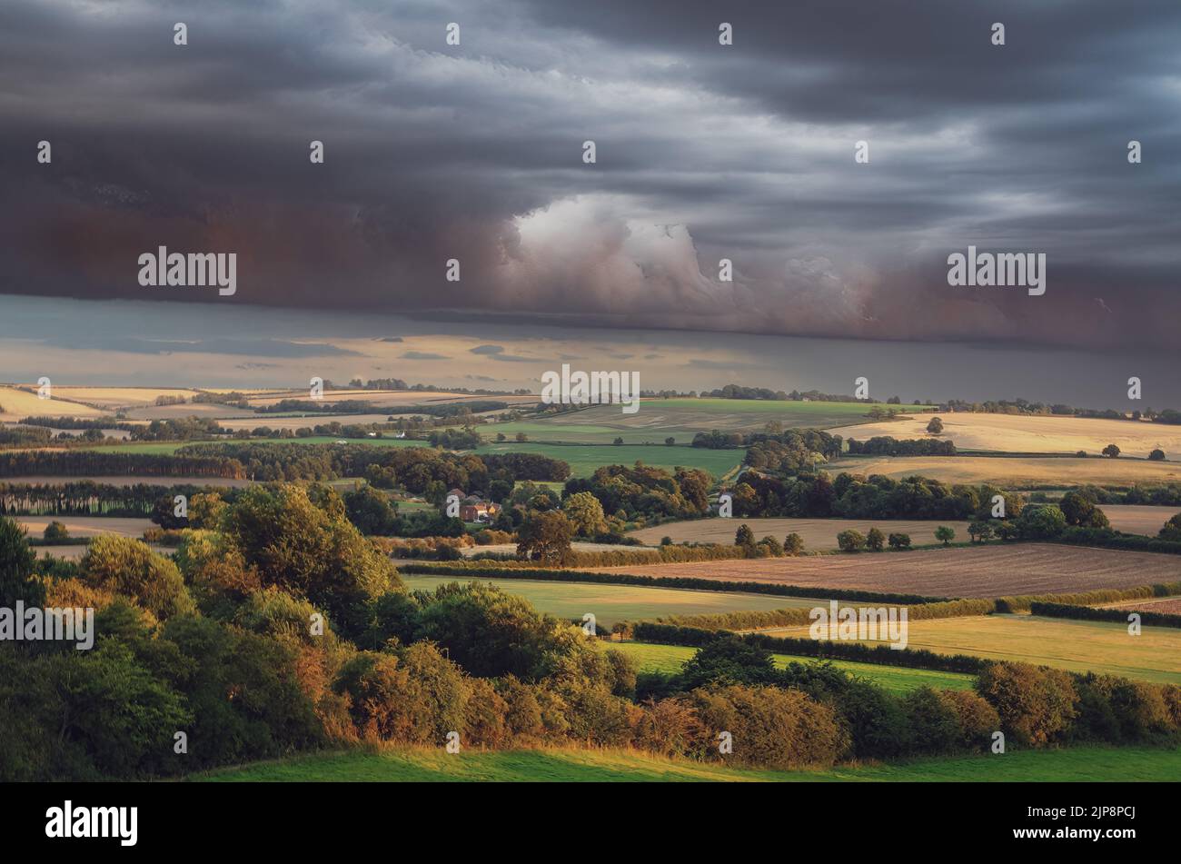 Storm front over summer evening landscape Stock Photo