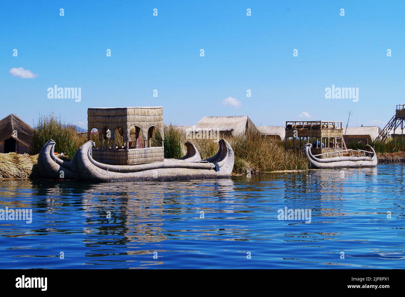 The traditional reed boat floating near Uros island in Peru Stock Photo