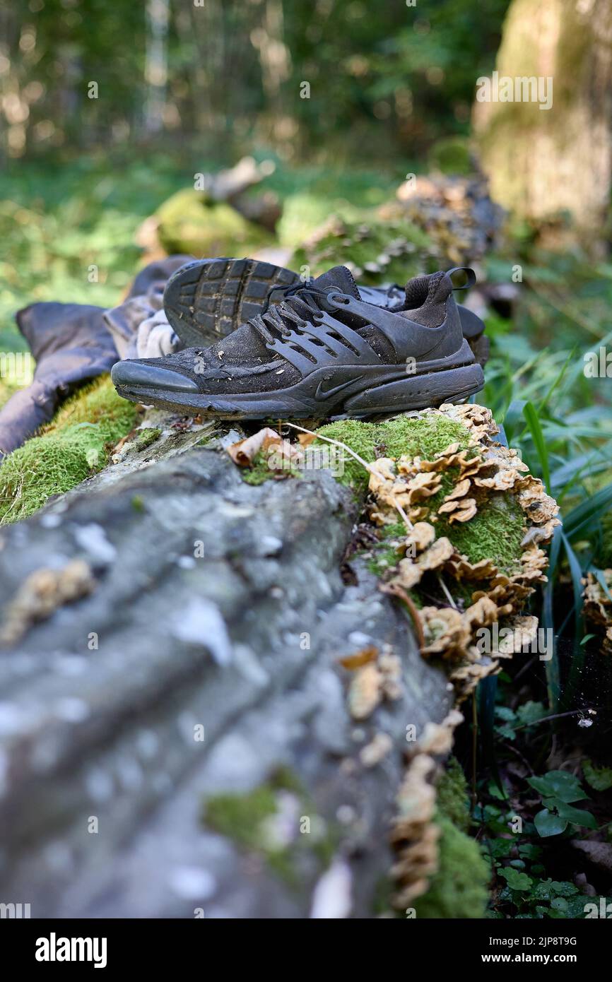 Worn out clothing abandoned by Said, refugee from Congo (DRC) who was wandering in the woods for 4 days avoiding Polish border patrols. Stock Photo