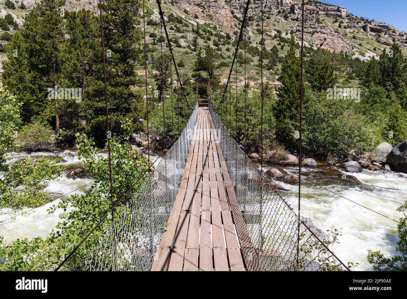 Suspension bridge over the Middle Popo Agie River at Sinks Canyon, Lander, Wyoming, USA Stock Photo