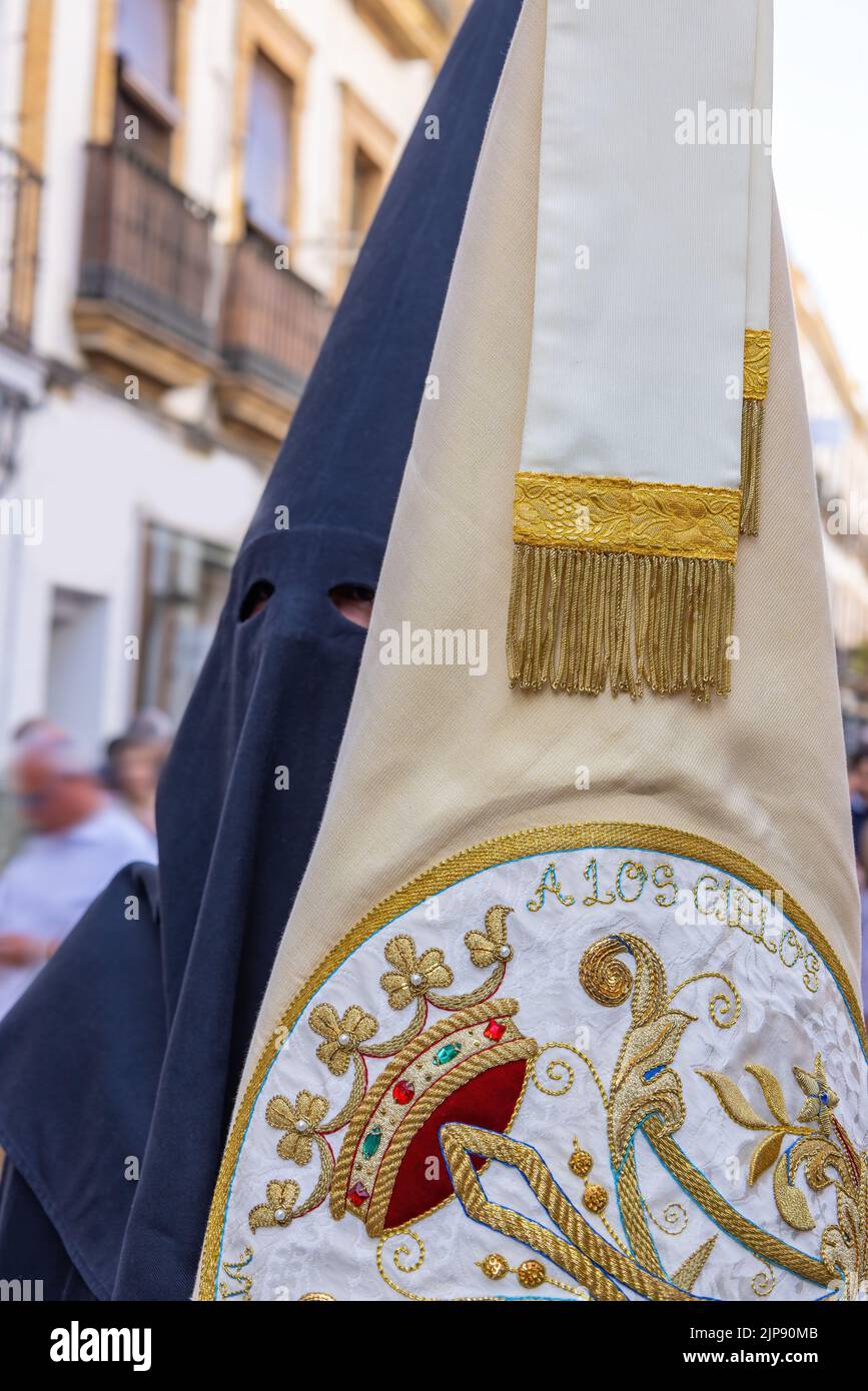 Badge of the Brotherhood and fellowship carried by a penitent in the Holy Week procession. The text 'A Los Cielos' means to the skies Stock Photo