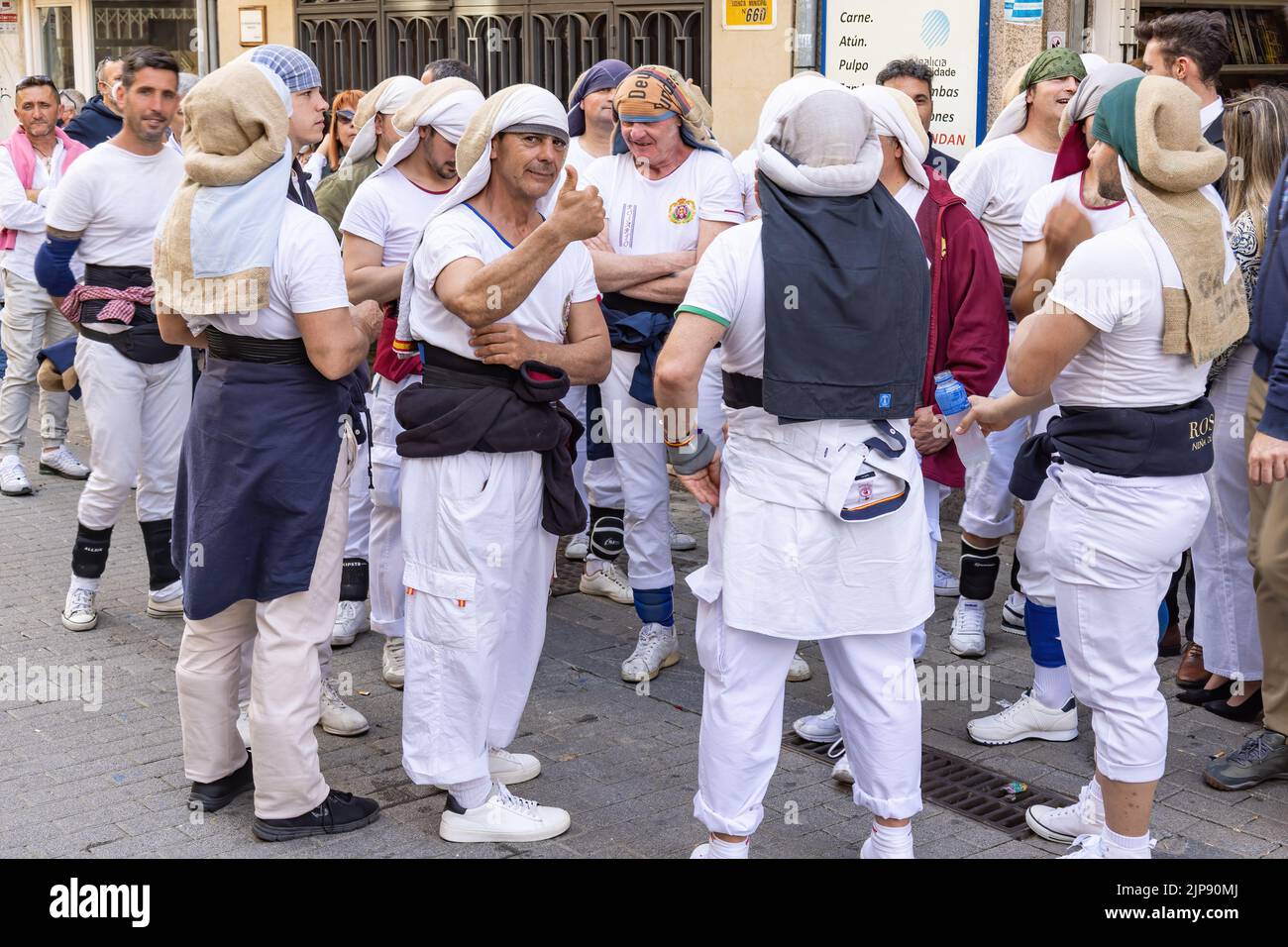 Huelva, Spain - April 10, 2022: A group of costalero bearers with the Costal (Sack) Piece of cloth that bearers place on their head and neck to better Stock Photo