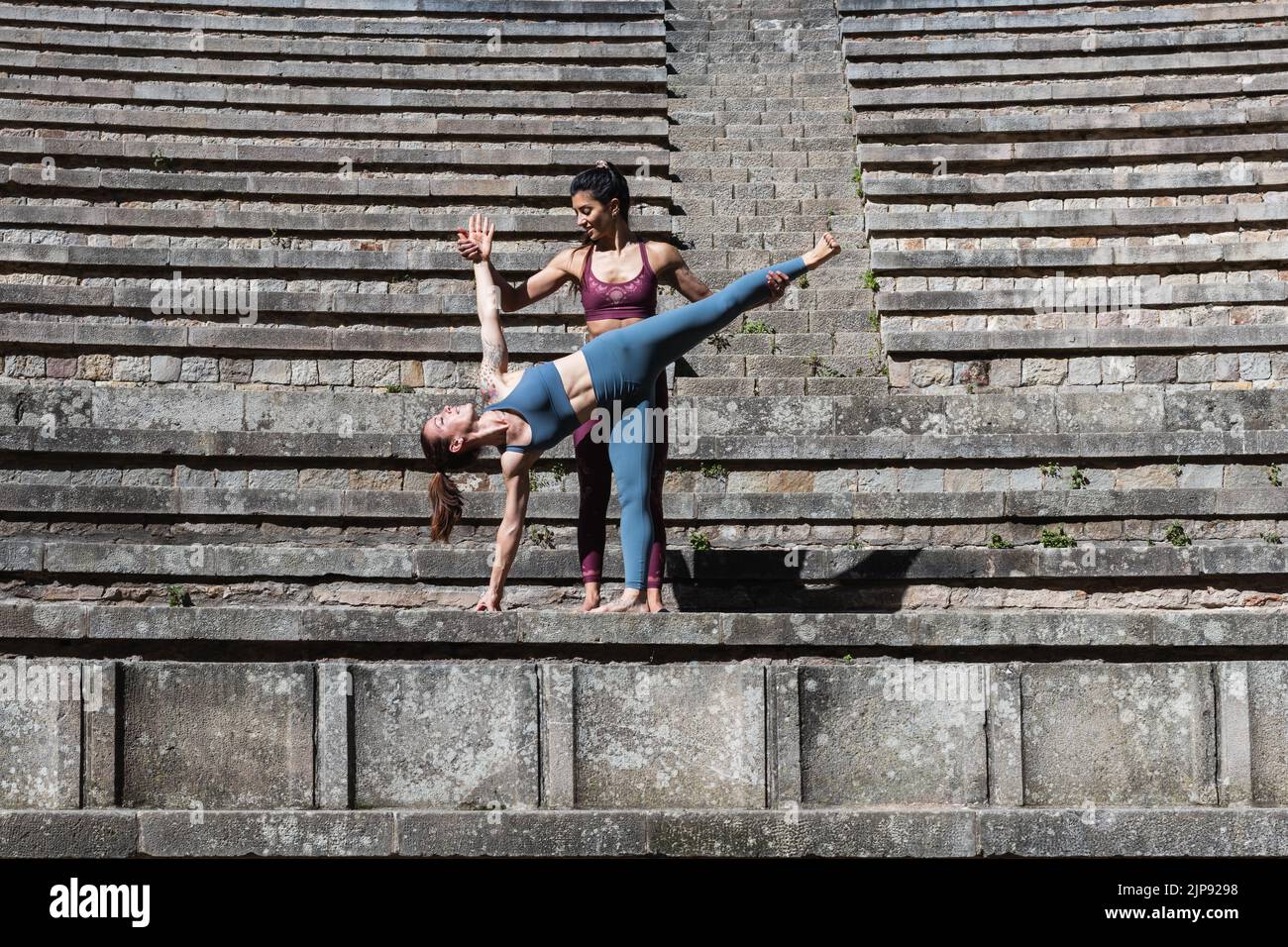 yoga, yoga teacher, yoga class, outdoor yoga, ardha chandrasana, yogas Stock Photo