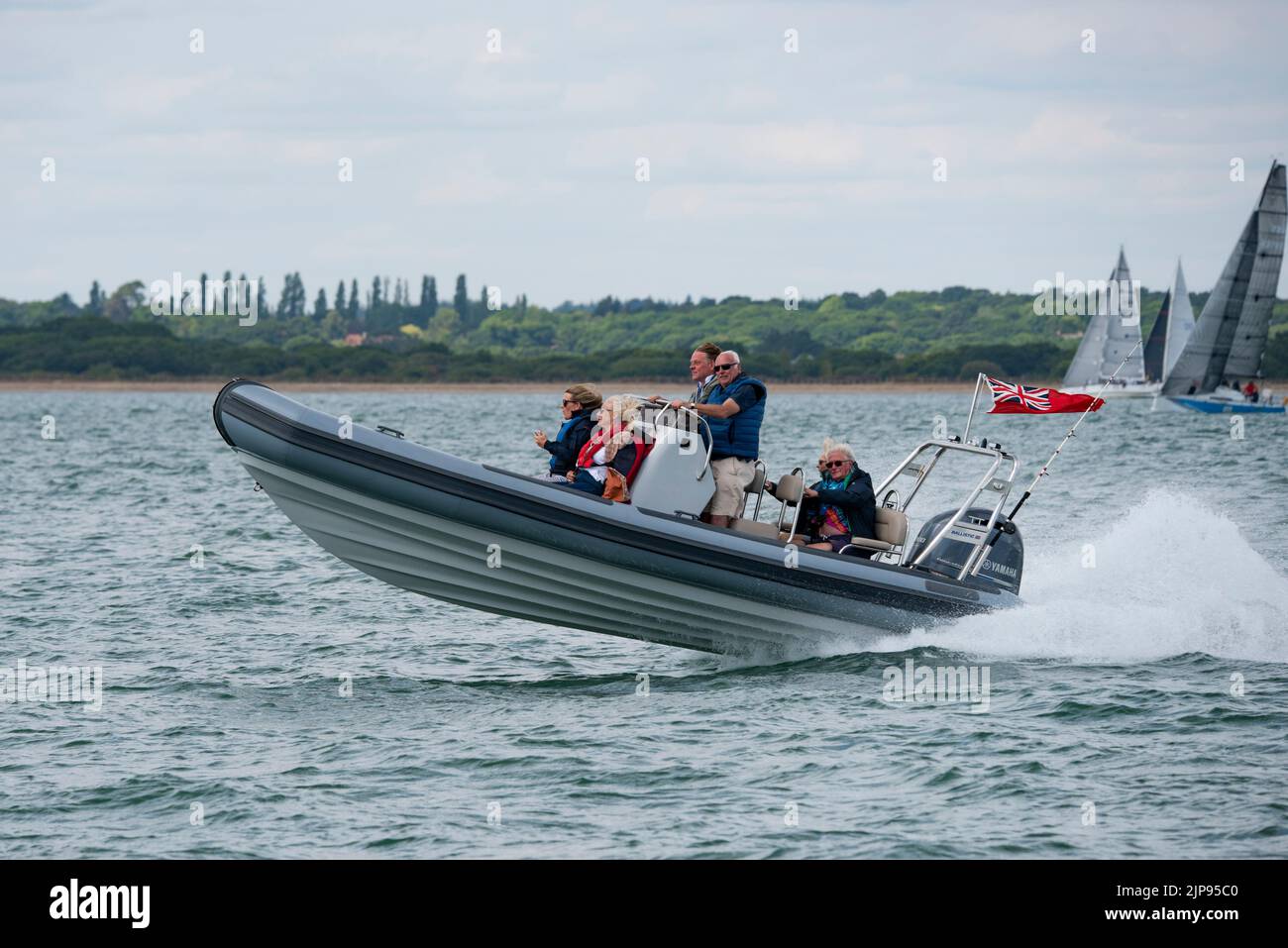 Looks like the family are out to enjoy the Cowes Week Regatta of the coast of The Isle of Wight in their nippy Ballistic RIB Stock Photo