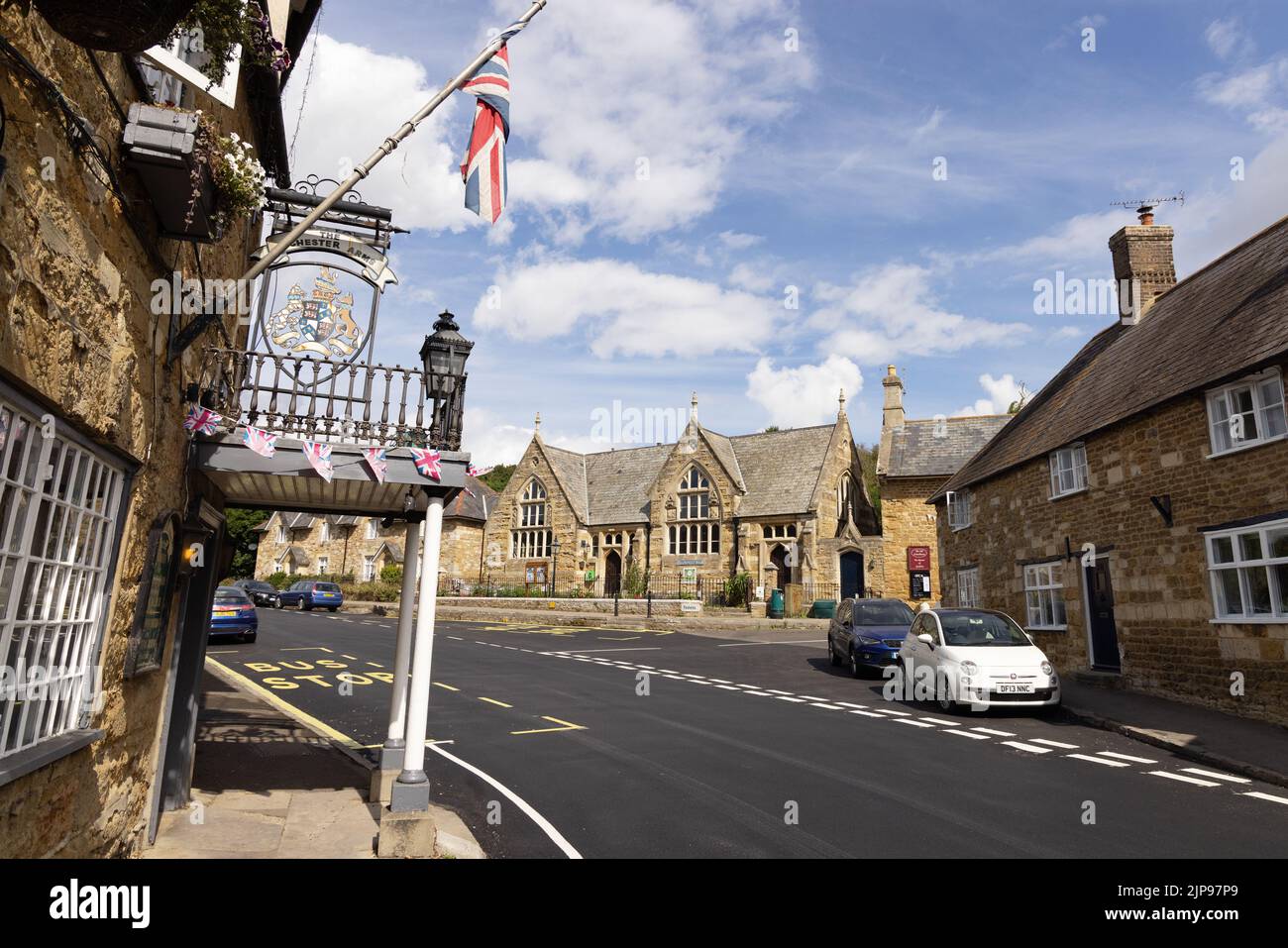 Dorset village; the village of Abbotsbury in Dorset, with The Ilchester Arms Hotel and Strangways Hall, South West England, Dorset UK Stock Photo