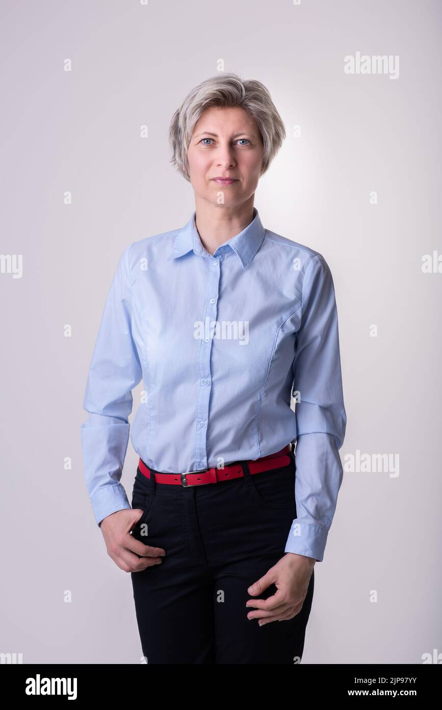 Woman in a blue shirt hi-res stock photography and images - Alamy