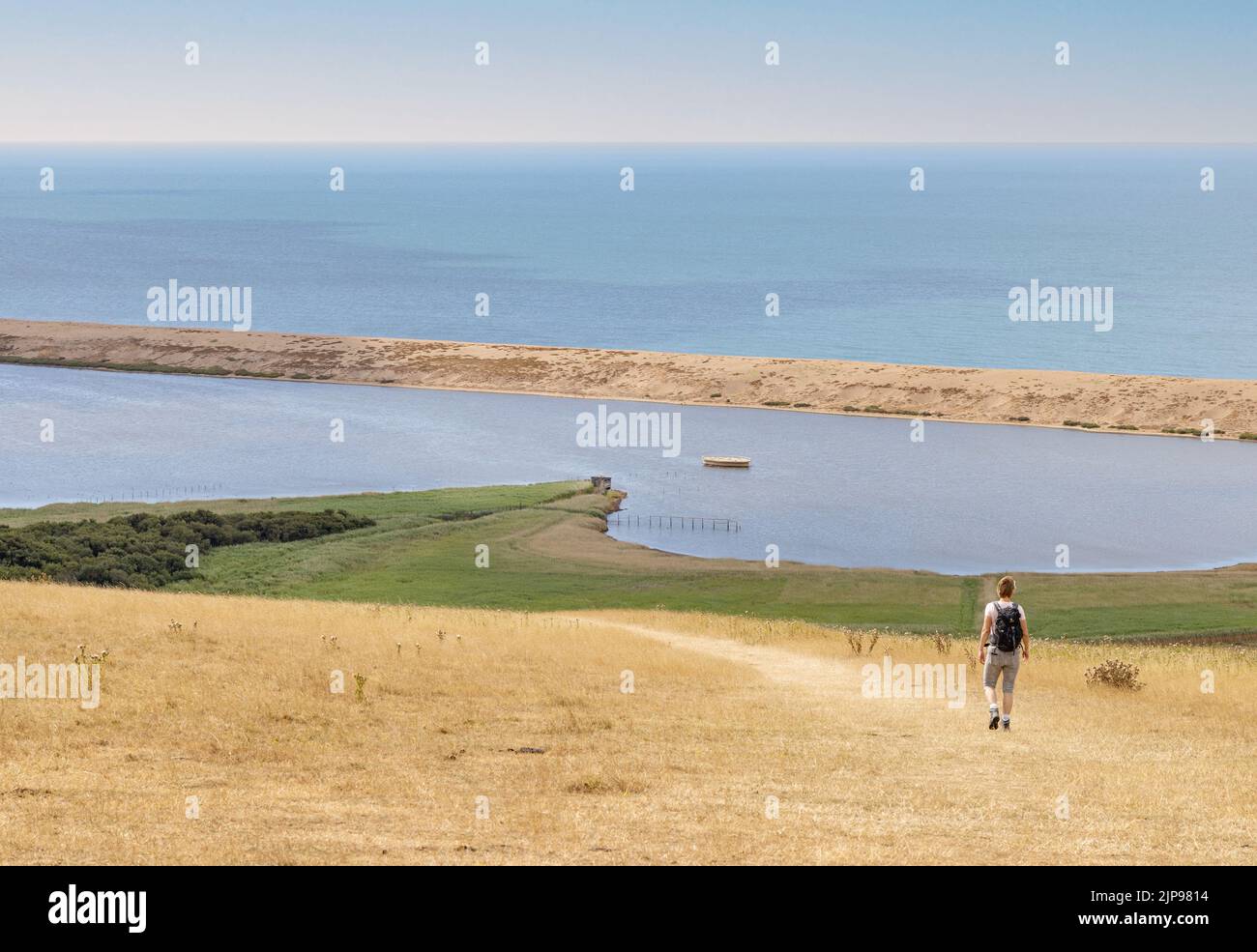 One woman walking the Dorset Coast Path, part of the South West coast