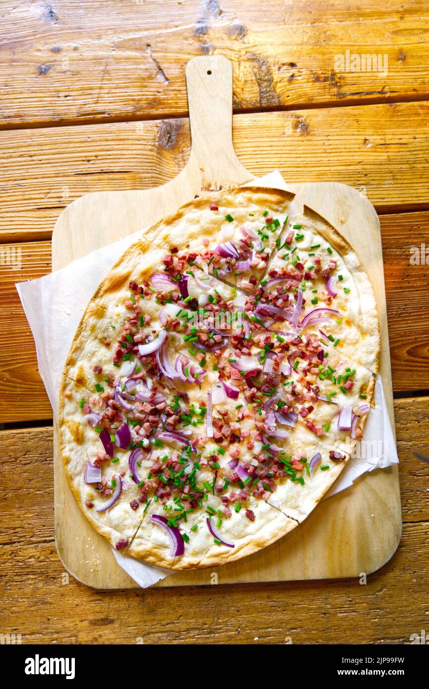 Flammkuchen “Tarte Flambée” traditional german food served with style Stock Photo