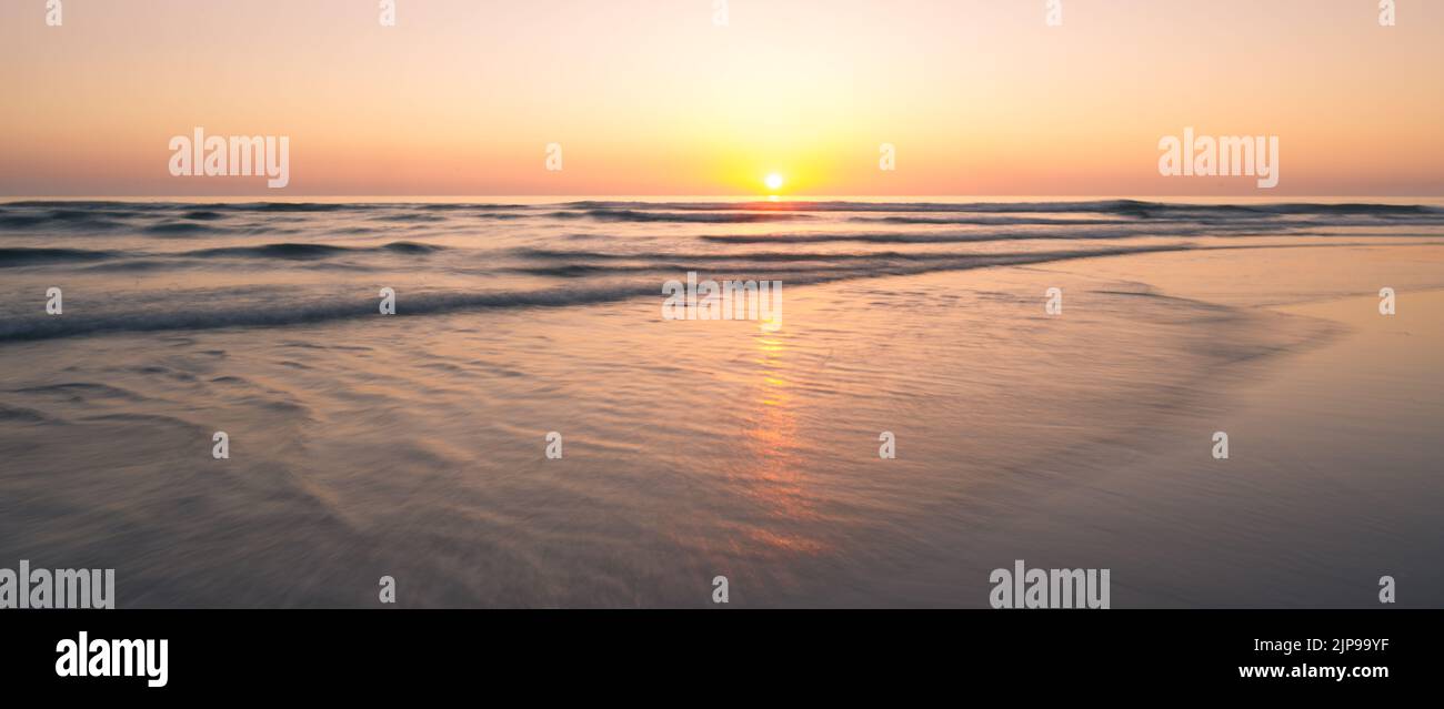 Landscape with sea sunset on beach Stock Photo - Alamy